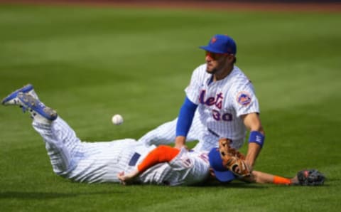 Aug 31, 2021; New York City, New York, USA; A ball hit by Miami Marlins first baseman Jesus Aguilar (not pictured) falls in-between New York Mets right fielder Michael Conforto (30) and New York Mets second baseman Jeff McNeil (6) during the sixth inning at Citi Field. Mandatory Credit: Gregory Fisher-USA TODAY Sports