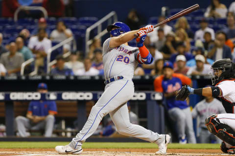 Sep 7, 2021; Miami, Florida, USA; New York Mets first baseman Pete Alonso (20) hits a home run during the first inning against the Miami Marlins at loanDepot Park. Mandatory Credit: Sam Navarro-USA TODAY Sports