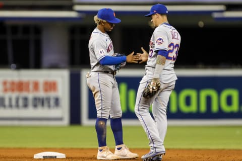 Sep 7, 2021; Miami, Florida, USA; New York Mets shortstop Francisco Lindor (12) and second baseman Javier Baez (23) celebrate after winning the game 9-4 against the Miami Marlins at loanDepot Park. Mandatory Credit: Sam Navarro-USA TODAY Sports