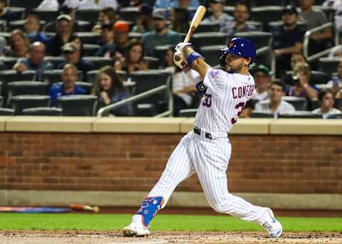 Sep 12, 2021; New York City, New York, USA; New York Mets right fielder Michael Conforto (30) hits an RBI single in the first inning against the New York Yankees at Citi Field. Mandatory Credit: Wendell Cruz-USA TODAY Sports