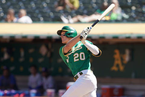 Sep 12, 2021; Oakland, California, USA; Oakland Athletics left fielder Mark Canha (20) bats during the fourth inning against the Texas Rangers at RingCentral Coliseum. Mandatory Credit: Darren Yamashita-USA TODAY Sports