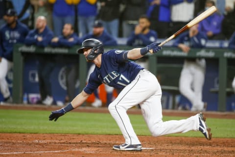 Oct 2, 2021; Seattle, Washington, USA; Seattle Mariners right fielder Mitch Haniger (17) hits a two-RBI single against the Los Angeles Angels during the eighth inning at T-Mobile Park. Mandatory Credit: Joe Nicholson-USA TODAY Sports