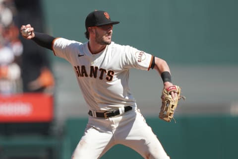 Oct 2, 2021; San Francisco, California, USA; San Francisco Giants third baseman Kris Bryant (23) throws the ball to first base to record an out during the fourth inning against the San Diego Padres at Oracle Park. Mandatory Credit: Darren Yamashita-USA TODAY Sports