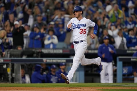 Oct 20, 2021; Los Angeles, California, USA; Los Angeles Dodgers first baseman Cody Bellinger (35) runs home to score on a single by left fielder AJ Pollock (not pictured) in the fifth inning against the Atlanta Braves during game four of the 2021 NLCS at Dodger Stadium. Mandatory Credit: Kirby Lee-USA TODAY Sports