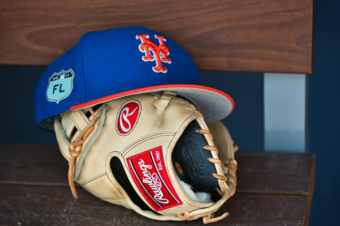 Mar 16, 2017; West Palm Beach, FL, USA; A view of a New York Mets hat and glove in the dugout during a spring training game against the Washington Nationals at The Ballpark of the Palm Beaches. Mandatory Credit: Jasen Vinlove-USA TODAY Sports