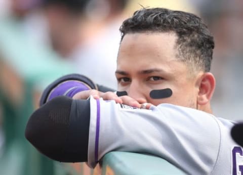 Aug 30, 2015; Pittsburgh, PA, USA; Colorado Rockies right fielder Carlos Gonzalez (5) looks on over the dugout railing against the Pittsburgh Pirates during the eighth inning at PNC Park. The Rockies won 5-0. Mandatory Credit: Charles LeClaire-USA TODAY Sports