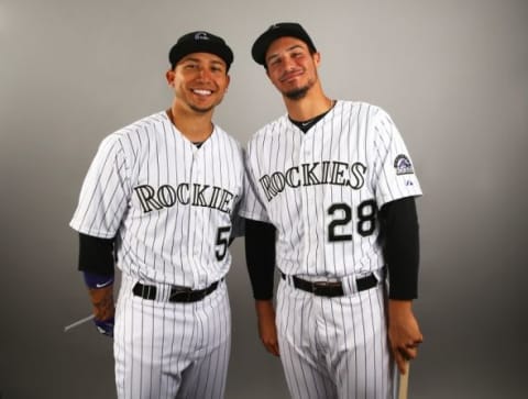 Mar 1, 2015; Scottsdale, AZ, USA; Colorado Rockies outfielder Carlos Gonzalez (left) and infielder Nolan Arenado pose for a portrait during photo day at Salt River Fields. Mandatory Credit: Mark J. Rebilas-USA TODAY Sports