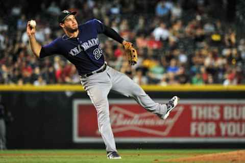 Sep 29, 2015; Phoenix, AZ, USA; Colorado Rockies third baseman Nolan Arenado (28) throws to first base for an out in the fifth inning against the Arizona Diamondbacks at Chase Field. Mandatory Credit: Matt Kartozian-USA TODAY Sports