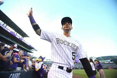 Sep 27, 2015; Denver, CO, USA; Colorado Rockies right fielder Carlos Gonzalez (5) waves to fans after the game against the Los Angeles Dodgers at Coors Field. The Rockies won 12-5. Mandatory Credit: Chris Humphreys-USA TODAY Sports