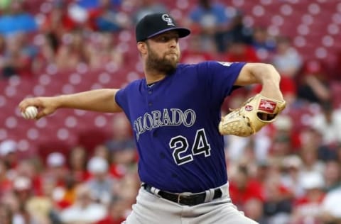 Apr 18, 2016; Cincinnati, OH, USA; Colorado Rockies starting pitcher Jordan Lyles throws against the Cincinnati Reds during the second inning at Great American Ball Park. Mandatory Credit: David Kohl-USA TODAY Sports