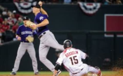 Apr 6, 2016; Phoenix, AZ, USA; Arizona Diamondbacks third baseman Phil Gosselin (15) is out as Colorado Rockies second baseman DJ LeMahieu (9) throws to first base during the seventh inning at Chase Field. Mandatory Credit: Matt Kartozian-USA TODAY Sports