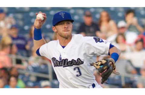 Trevor Story makes a throw for the Tulsa Drillers in 2014. Photo by Rich Crimi.