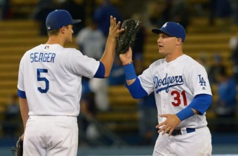 May 24, 2016; Los Angeles, CA, USA; Los Angeles Dodgers center fielder Joc Pederson (31) and shortstop Corey Seager (5) defeating the Cincinnati Reds at Dodger Stadium. Dodgers won 8-2. Mandatory Credit: Jayne Kamin-Oncea-USA TODAY Sports