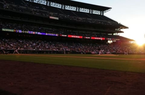 Jun 1, 2015; Denver, CO, USA; General wide view of a fifth inning sunset at Coors Field during the game between the Los Angeles Dodgers against the Colorado Rockies at Coors Field. Mandatory Credit: Ron Chenoy-USA TODAY Sports