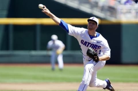 Jun 19, 2015; Omaha, NE, USA; Florida Gators pitcher Logan Shore (32) throws against Virginia Cavaliers in the first inning in the 2015 College World Series at TD Ameritrade Park. Mandatory Credit: Bruce Thorson-USA TODAY Sports