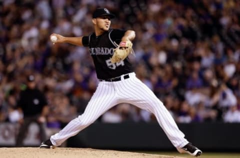 Jun 23, 2016; Denver, CO, USA; Colorado Rockies relief pitcher Carlos Estevez (54) pitches in the ninth inning against the Arizona Diamondbacks at Coors Field. The Diamondbacks won 7-6. Mandatory Credit: Isaiah J. Downing-USA TODAY Sports