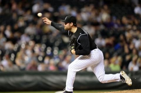 Jul 7, 2016; Denver, CO, USA; Colorado Rockies relief pitcher Adam Ottavino (0) delivers a pitch in ninth inning against the Philadelphia Phillies at Coors Field. The Rockies defeated the Phillies 11-2. Mandatory Credit: Ron Chenoy-USA TODAY Sports