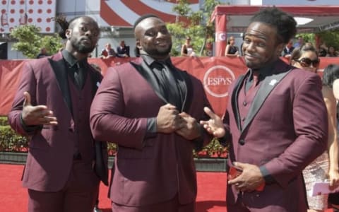 Jul 13, 2016; Los Angeles, CA, USA; WWE wrestlers of The New Day known as Kofi Nahaje Sarkodie-Mensah (left) and Ettore Ewen (center) and Austin Watson (right) arrive on the red carpet for the 2016 ESPY Awards at Microsoft Theater. Mandatory Credit: Kirby Lee-USA TODAY Sports