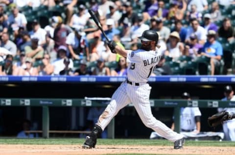 Jun 26, 2016; Denver, CO, USA; Colorado Rockies center fielder Charlie Blackmon (19) hits a solo home run in the third inning at against the Arizona Diamondbacks Coors Field. Mandatory Credit: Ron Chenoy-USA TODAY Sports