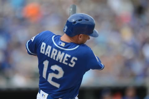 Mar 5, 2016; Surprise, AZ, USA; Kansas City Royals shortstop Clint Barmes (12) hits a double in the third inning against the Chicago White Sox at Surprise Stadium. Mandatory Credit: Joe Camporeale-USA TODAY Sports