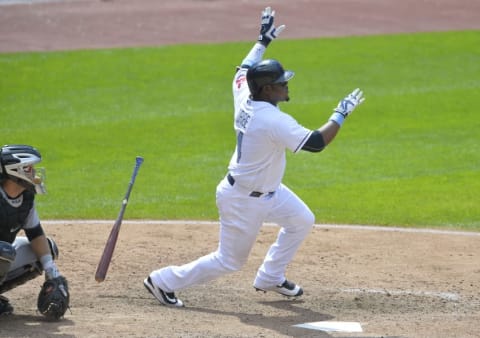 Jun 19, 2016; Cleveland, OH, USA; Cleveland Indians third baseman Juan Uribe (4) doubles in the ninth inning against the Chicago White Sox at Progressive Field. Mandatory Credit: David Richard-USA TODAY Sports