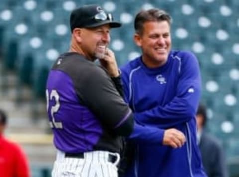 Apr 20, 2015; Denver, CO, USA; Colorado Rockies manager Walt Weiss (left) talks with head athletic trainer Keith Dugger during batting practice prior to the game against the San Diego Padres at Coors Field. Mandatory Credit: Isaiah J. Downing-USA TODAY Sports