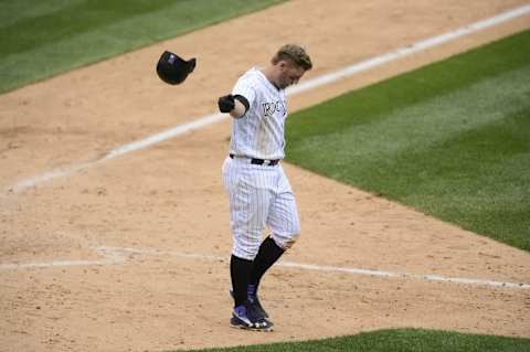 Jul 20, 2016; Denver, CO, USA; Colorado Rockies first baseman Mark Reynolds (12) reacts to striking out in the eighth inning against the Tampa Bay Rays at Coors Field. The Rays defeated the Rockies 11-3. Mandatory Credit: Ron Chenoy-USA TODAY Sports