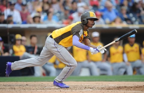 Jul 10, 2016; San Diego, CA, USA; World batter Raimel Tapia hits a two-run double in the 9th inning during the All Star Game futures baseball game at PetCo Park. Mandatory Credit: Gary A. Vasquez-USA TODAY Sports