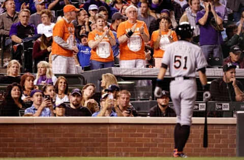 Aug 5, 2016; Denver, CO, USA; Fans cheer as Miami Marlins pinch hitter Ichiro Suzuki (51) gets ready to bat in the seventh inning against the Colorado Rockies at Coors Field. Mandatory Credit: Isaiah J. Downing-USA TODAY Sports