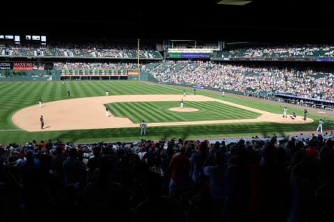 Aug 7, 2016; Denver, CO, USA; Members of the congratulate right fielder Ichiro Suzuki (51) prepares to take a bat in the seventh inning against the Colorado Rockies at Coors Field. Mandatory Credit: Ron Chenoy-USA TODAY Sports