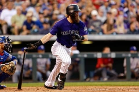 Aug 8, 2016; Denver, CO, USA; Colorado Rockies center fielder Charlie Blackmon (19) hits an RBI single in the third inning against the Texas Rangers at Coors Field. Mandatory Credit: Isaiah J. Downing-USA TODAY Sports