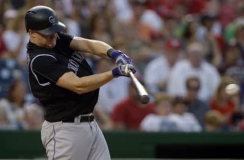 Aug 26, 2016; Washington, DC, USA; Colorado Rockies catcher Nick Hundley (4) singles ring the second inning against the Washington Nationals at Nationals Park. Mandatory Credit: Tommy Gilligan-USA TODAY Sports