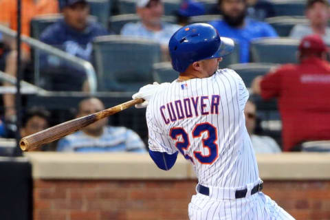 May 26, 2015; New York City, NY, USA; New York Mets left fielder Michael Cuddyer (23) singles to shallow left allowing two runners to score and a man to advance during the third inning against the Philadelphia Phillies at Citi Field. Mandatory Credit: Anthony Gruppuso-USA TODAY Sports