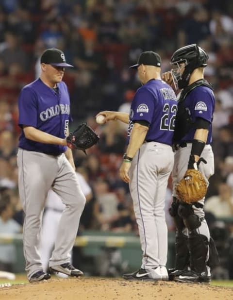 May 26, 2016; Boston, MA, USA; Colorado Rockies manager Walt Weiss (22) hand the ball over to Colorado Rockies relief pitcher Jake McGee (51) as they take on the Boston Red Sox in the ninth inning at Fenway Park. Colorado defeated the Red Sox 8-2. Mandatory Credit: David Butler II-USA TODAY Sports