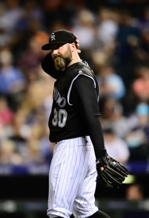 Jul 21, 2016; Denver, CO, USA; Colorado Rockies relief pitcher Jason Motte (30) reacts after giving up runs to the Atlanta Braves in the ninth inning at Coors Field. The Rockies defeated the Braves 7-3. Mandatory Credit: Ron Chenoy-USA TODAY Sports