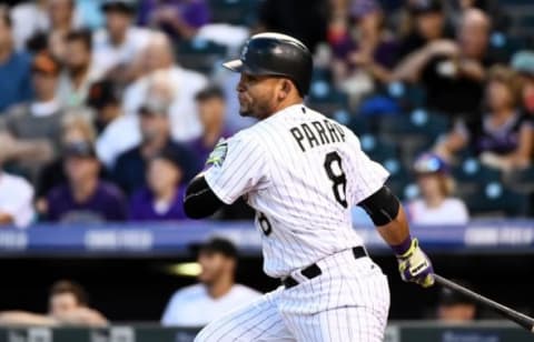 Sep 6, 2016; Denver, CO, USA; Colorado Rockies left fielder Gerardo Parra (8) singles in the second inning against the San Francisco Giants at Coors Field. Mandatory Credit: Ron Chenoy-USA TODAY Sports