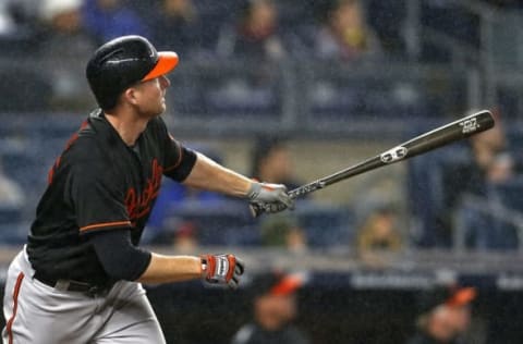 Sep 30, 2016; Bronx, NY, USA; Baltimore Orioles right fielder Mark Trumbo (45) hits a 2-run home run during the fifth inning against the New York Yankees at Yankee Stadium. Mandatory Credit: Adam Hunger-USA TODAY Sports