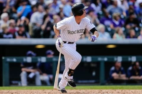 Oct 2, 2016; Denver, CO, USA; Colorado Rockies first baseman Jordan Patterson (72) follows his ball on an RBI double in the fifth inning against the Milwaukee Brewers at Coors Field. Mandatory Credit: Isaiah J. Downing-USA TODAY Sports