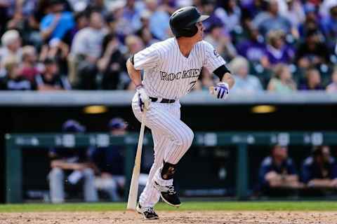 Oct 2, 2016; Denver, CO, USA; Colorado Rockies first baseman Jordan Patterson (72) follows his ball on an RBI double in the fifth inning against the Milwaukee Brewers at Coors Field. Mandatory Credit: Isaiah J. Downing-USA TODAY Sports