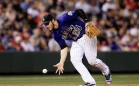 Sep 19, 2016; Denver, CO, USA; Colorado Rockies third baseman Nolan Arenado (28) fields the ball in the sixth inning against the St. Louis Cardinals at Coors Field. Mandatory Credit: Isaiah J. Downing-USA TODAY Sports