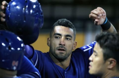 June 15, 2016; Oakland, CA, USA; Texas Rangers center fielder Ian Desmond (20) is greeted in the dugout after scoring on a sacrafice fly ball by DH Price Fielder (84) (not pictured) in the sixth inning of their MLB baseball game with the Oakland Athletics at O.co Coliseum. Mandatory Credit: Lance Iversen-USA TODAY Sports