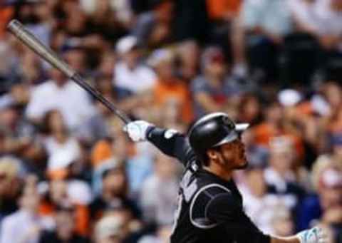 Sep 7, 2016; Denver, CO, USA; Colorado Rockies third baseman Nolan Arenado (28) watches his ball on a home run in the ninth inning against the San Francisco Giants at Coors Field. Mandatory Credit: Isaiah J. Downing-USA TODAY Sports