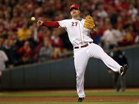 Scott Rolen fields and throws a ball to first base in the 2012 NLDS. Getty Images