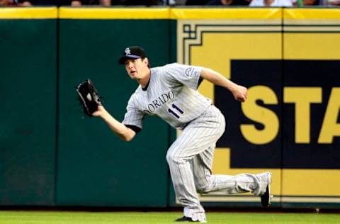 HOUSTON – MAY 19: Right fielder Brad Hawpe #11 of the Colorado Rockies makes a catch on a dipping fly ball against the Houston Astros at Minute Maid Park on May 19, 2010 in Houston, Texas. (Photo by Bob Levey/Getty Images)