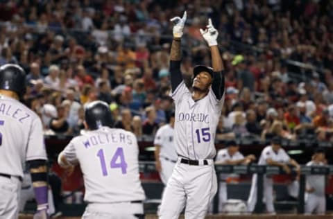 PHOENIX, AZ – JULY 20: Raimel Tapia #15 of the Colorado Rockies gestures as he crosses home plate after hitting a grand slam home run against the Arizona Diamondbacks during the seventh inning of an MLB game at Chase Field on July 20, 2018 in Phoenix, Arizona. (Photo by Ralph Freso/Getty Images)