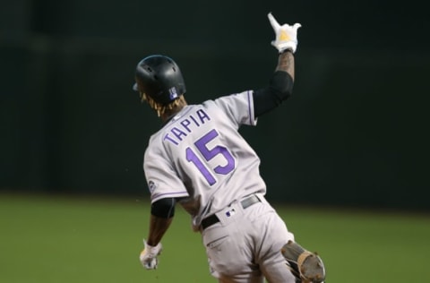 PHOENIX, AZ – JULY 20: Raimel Tapia #15 of the Colorado Rockies gestures as he rounds first base after hitting a grand slam home run against the Arizona Diamondbacks during the seventh inning of an MLB game at Chase Field on July 20, 2018 in Phoenix, Arizona. (Photo by Ralph Freso/Getty Images)