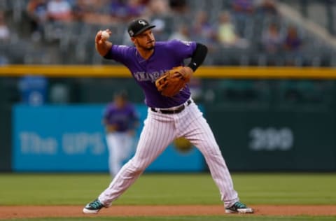 DENVER, CO – JULY 25: Third baseman Nolan Arenado #28 of the Colorado Rockies throws to first base for the third out of the first inning against the Houston Astros during interleague play at Coors Field on July 25, 2018 in Denver, Colorado. (Photo by Justin Edmonds/Getty Images)