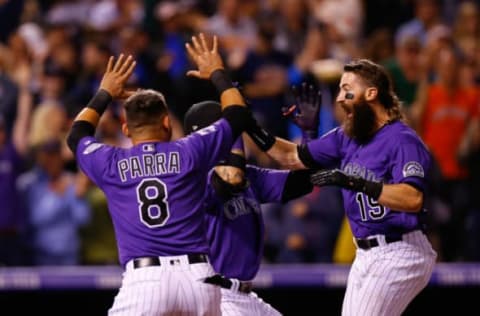 DENVER, CO – JULY 25: Charlie Blackmon #19 of the Colorado Rockies celebrates his walk-off solo home run with Gerardo Parra #8 and Carlos Gonzalez #5 in the in the ninth inning against the Houston Astros during interleague play at Coors Field on July 25, 2018 in Denver, Colorado. The Rockies defeated the Astros 3-2. (Photo by Justin Edmonds/Getty Images)