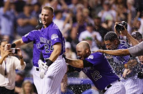 DENVER, CO – AUGUST 11: Ryan McMahon #24 of the Colorado Rockies celebrates with Chris Iannetta #22 of the Colorado Rockies after McMahon hit a walk-off, three-run home run against the Los Angeles Dodgers at Coors Field on August 11, 2018 in Denver, Colorado. Colorado won 3-2. (Photo by Joe Mahoney/Getty Images)