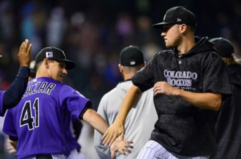 DENVER, CO – AUGUST 6: Kyle Freeland #21 of the Colorado Rockies celebrates a 2-0 win over the Pittsburgh Pirates with assistant hitting coach Jeff Salazar #41 at Coors Field on August 6, 2018 in Denver, Colorado. (Photo by Dustin Bradford/Getty Images)